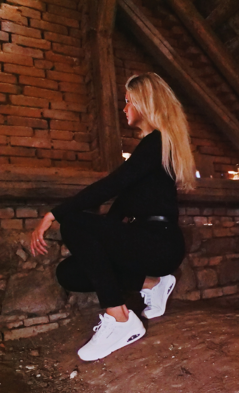 Woman in brick interior